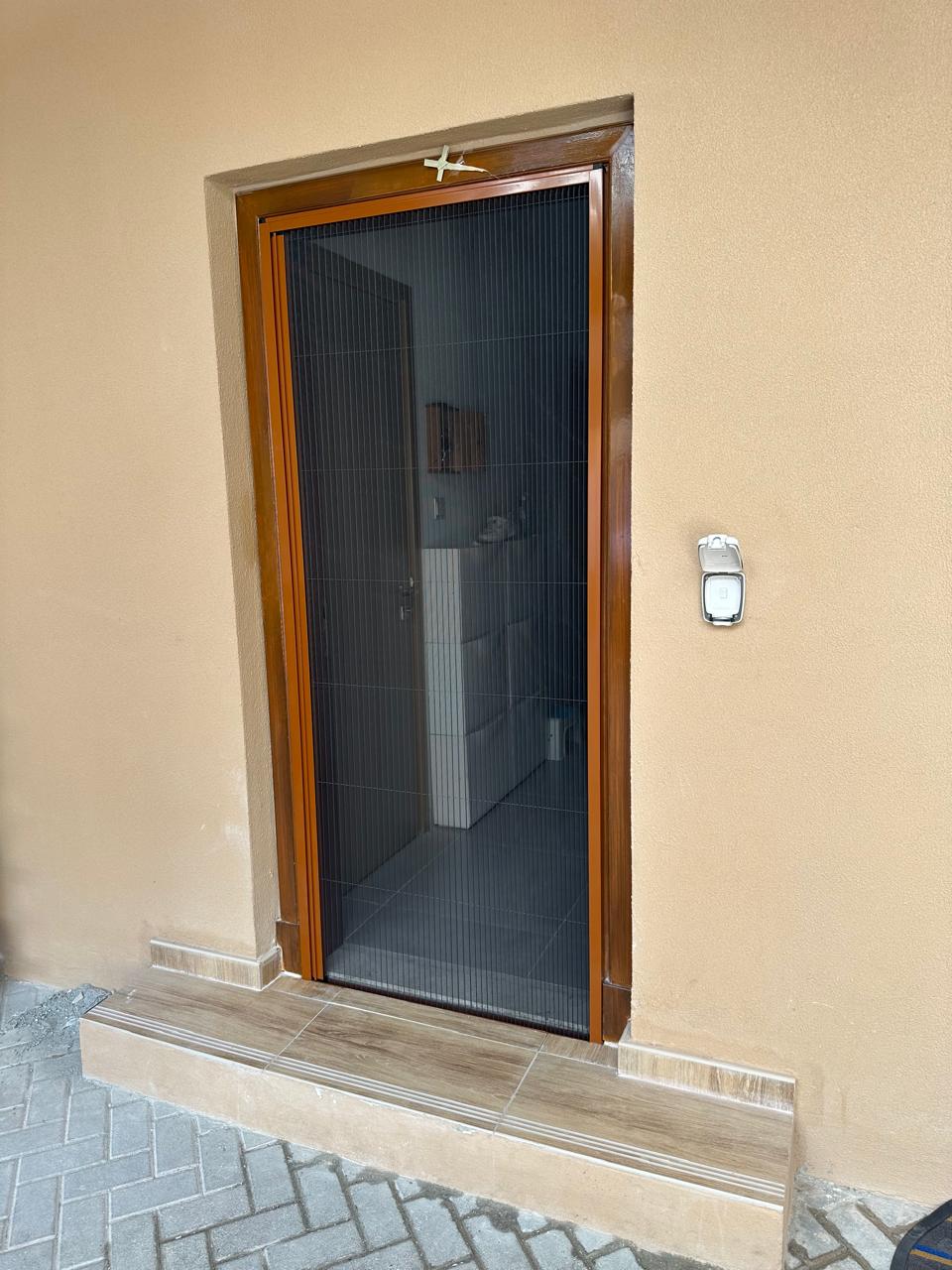 Top cassette housing the tubular motor of a fly screen in Dubai