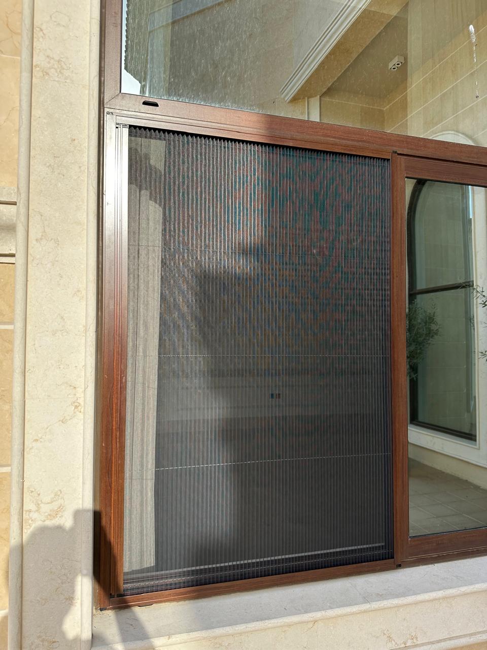 Double-sided fly screen on a four panel sliding door in a Dubai home
